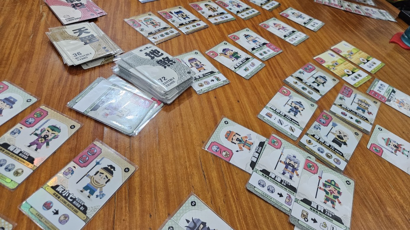 Gameplay photo of the board game 108 Outlaws featuring various components and board state.