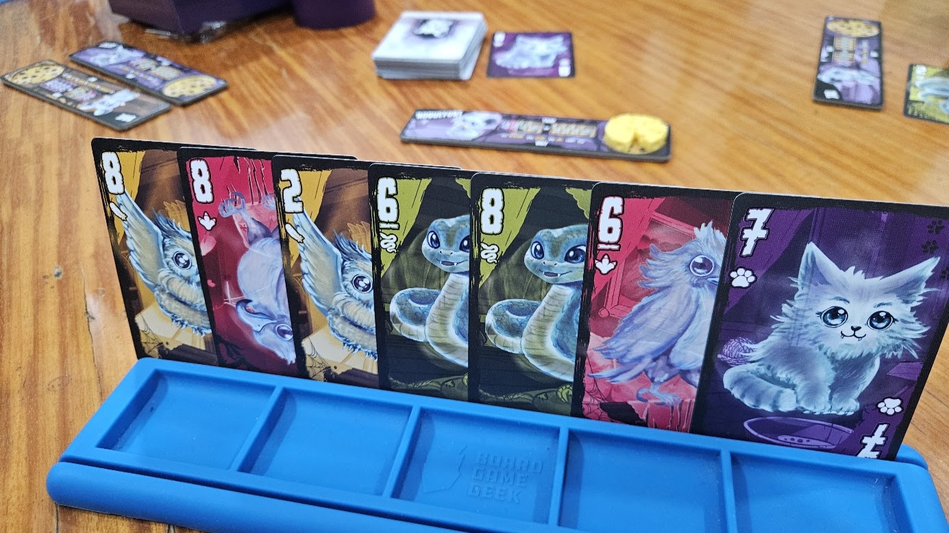 Gameplay photo of the board game Haunted Mouse featuring various components and board state.