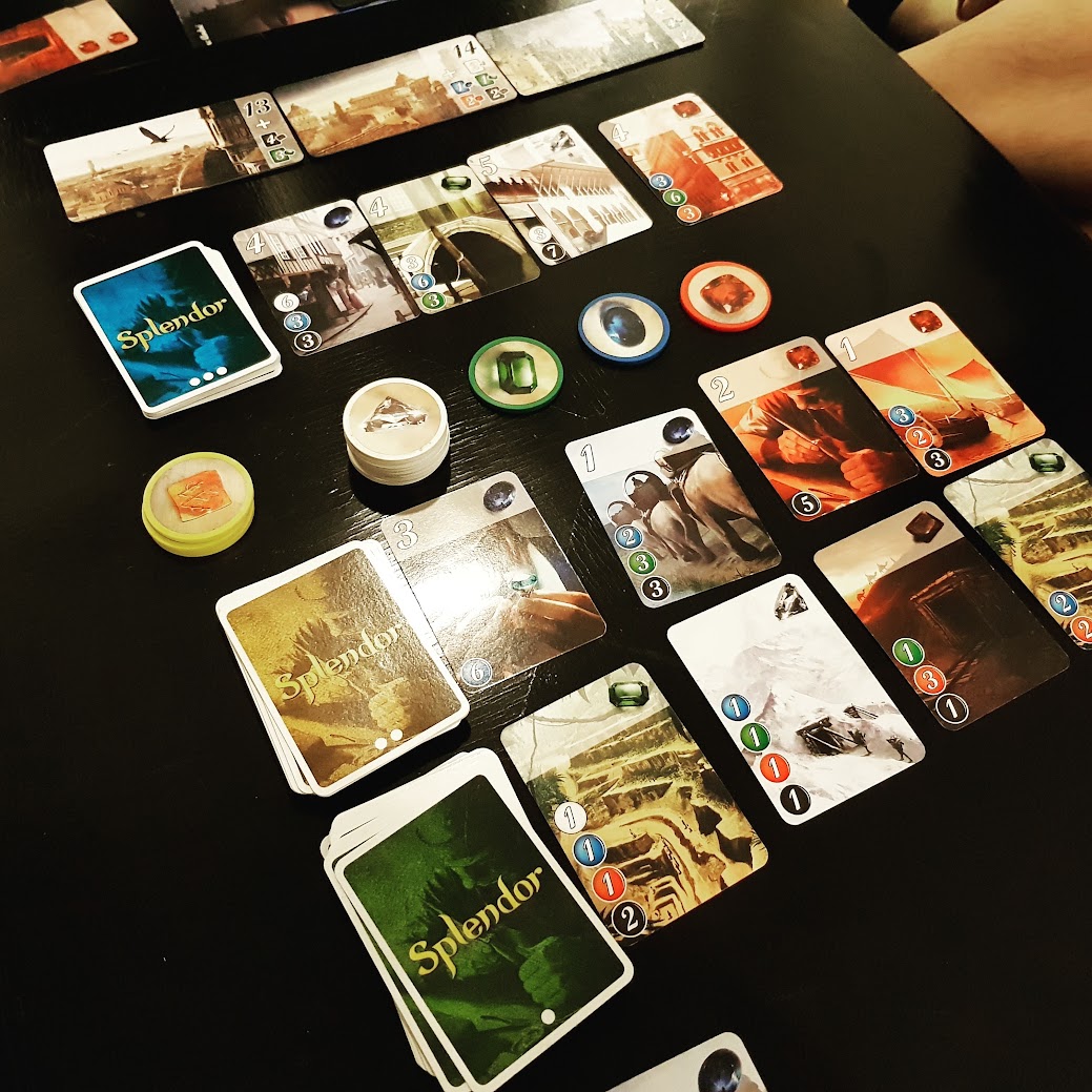Gameplay photo of the board game Splendor: Cities of Splendor featuring various components and board state.