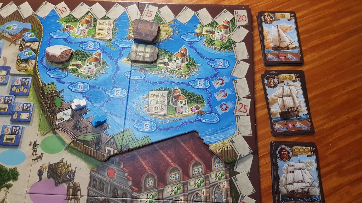 Gameplay photo of the board game Village: Port featuring various components and board state.