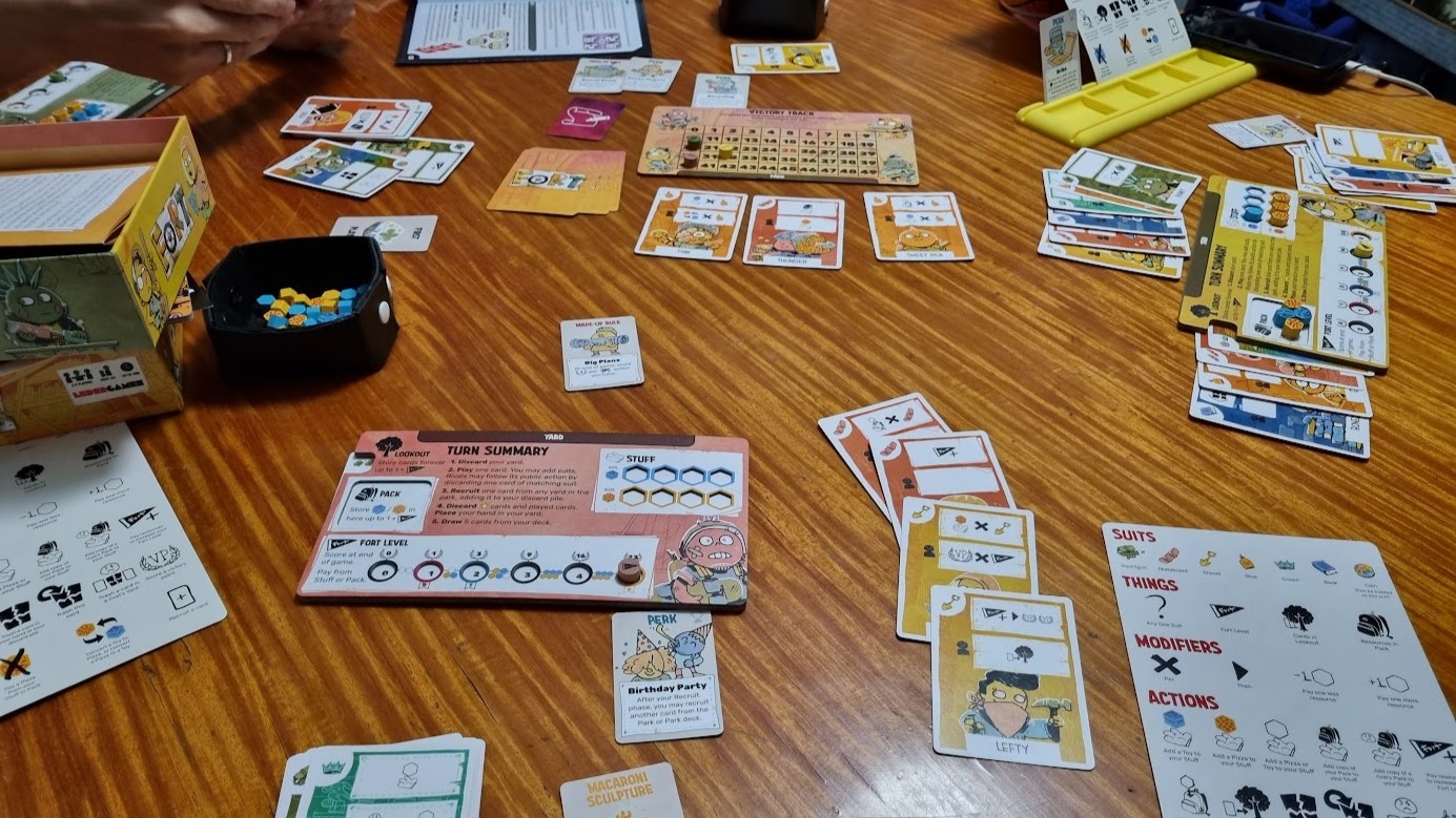Gameplay photo of the board game Fort featuring various components and board state.