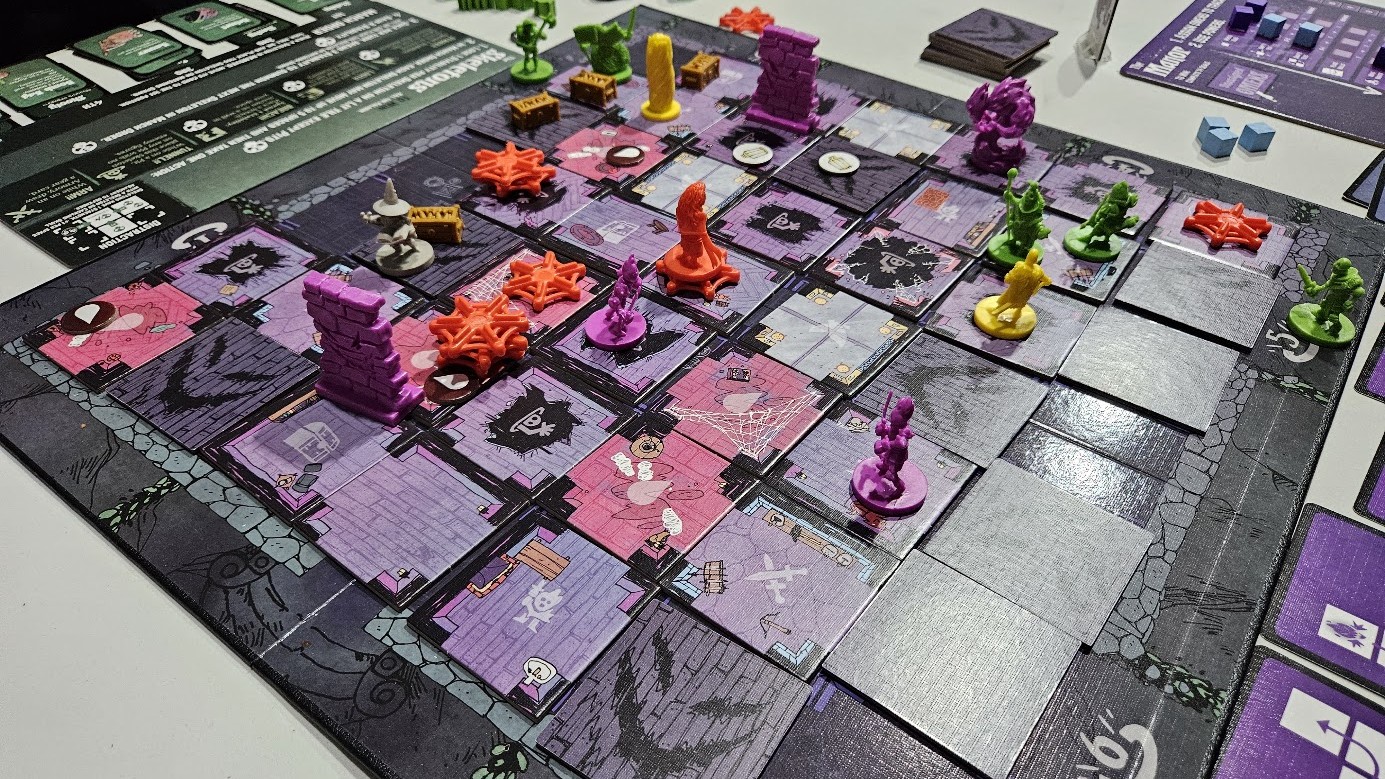 Gameplay photo of the board game Vast: The Mysterious Manor featuring various components and board state.