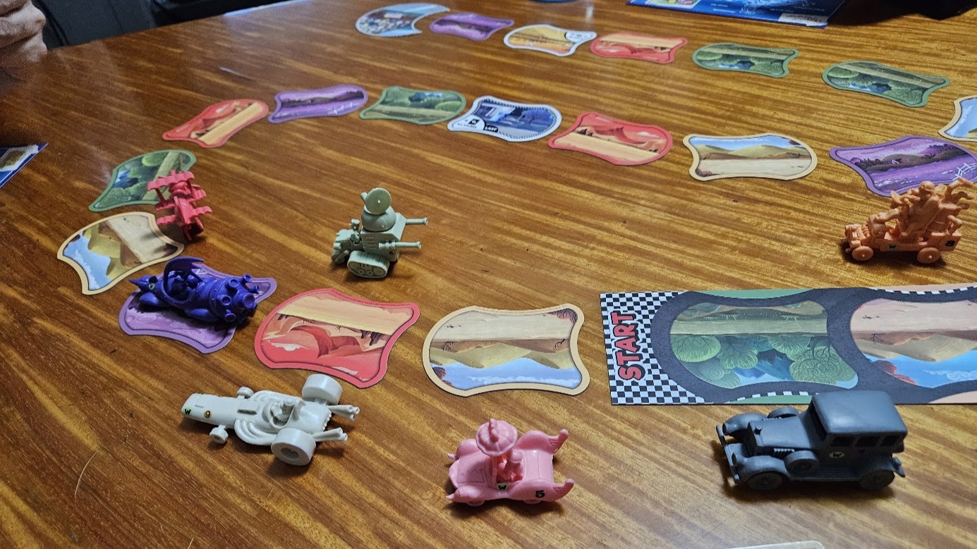 Gameplay photo of the board game Wacky Races: The Board Game featuring various components and board state.