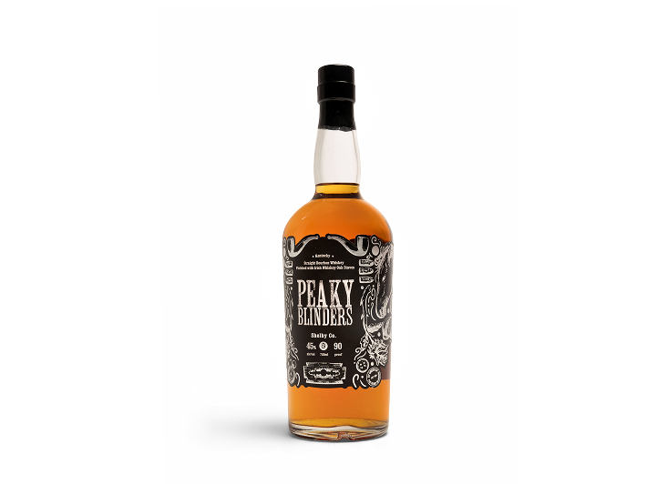 Bottle of Peaky Blinders Tennessee Whiskey with black and white label and black cap.