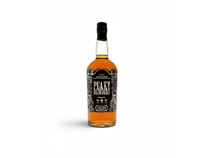 Bottle of Peaky Blinders whiskey with black and white decorative label on a white background.