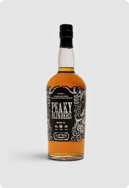 Bottle of Peaky Blinders Kentucky Straight Bourbon Whiskey with black and white label and amber liquid.
