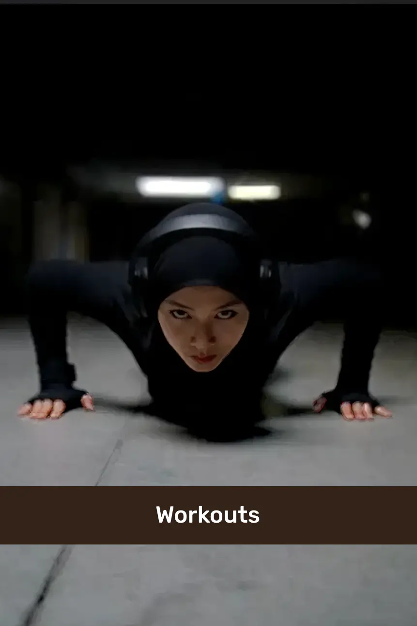 Person in black workout attire and headphones doing push-ups in a dimly lit indoor space.
