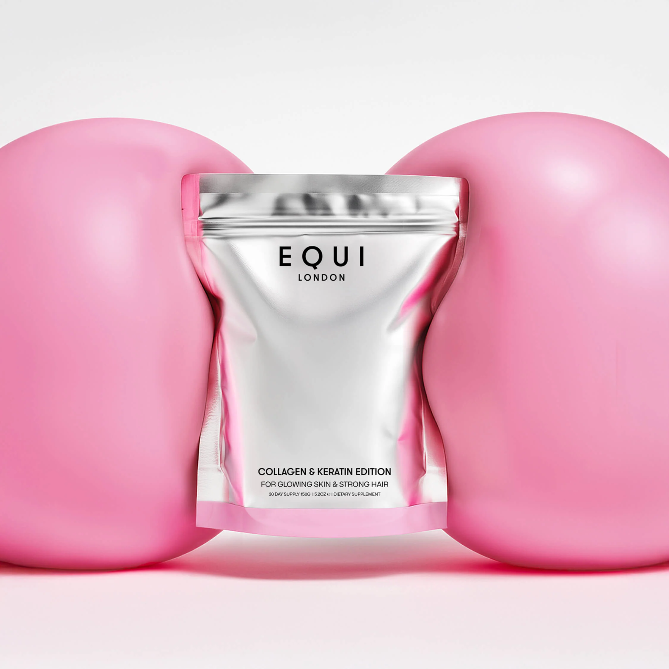 EQUI product shot in foil packaging between two pink balloon material objects