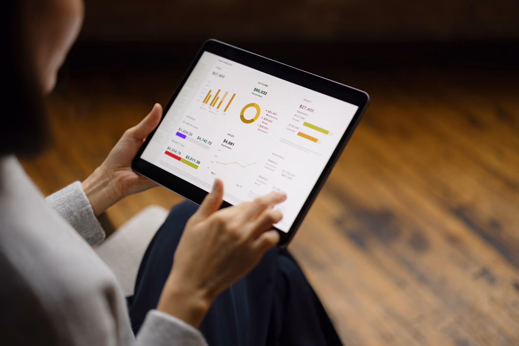 Woman looking at report overview on tablet