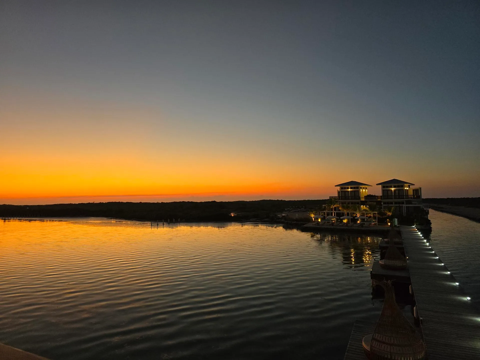 Sunset over Aruna Resort and lagoon.
