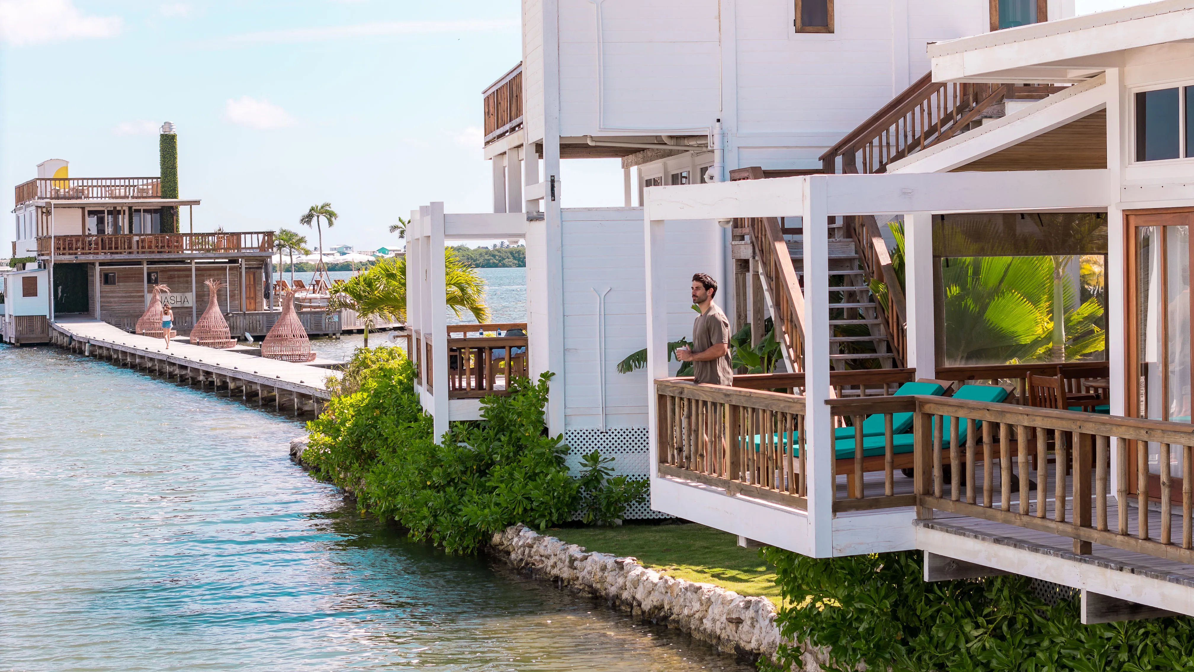 Waterfront villas and dock leading to Asha restaurant at Aruna Resort Belize