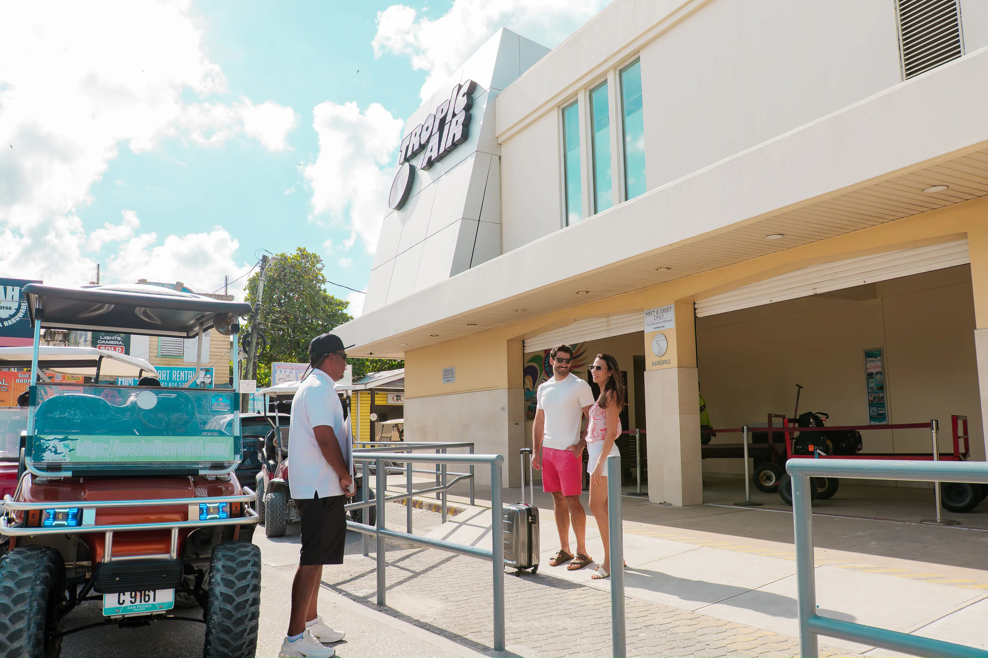 Couple arriving at Tropic Air terminal in San Pedro, Ambergris Caye