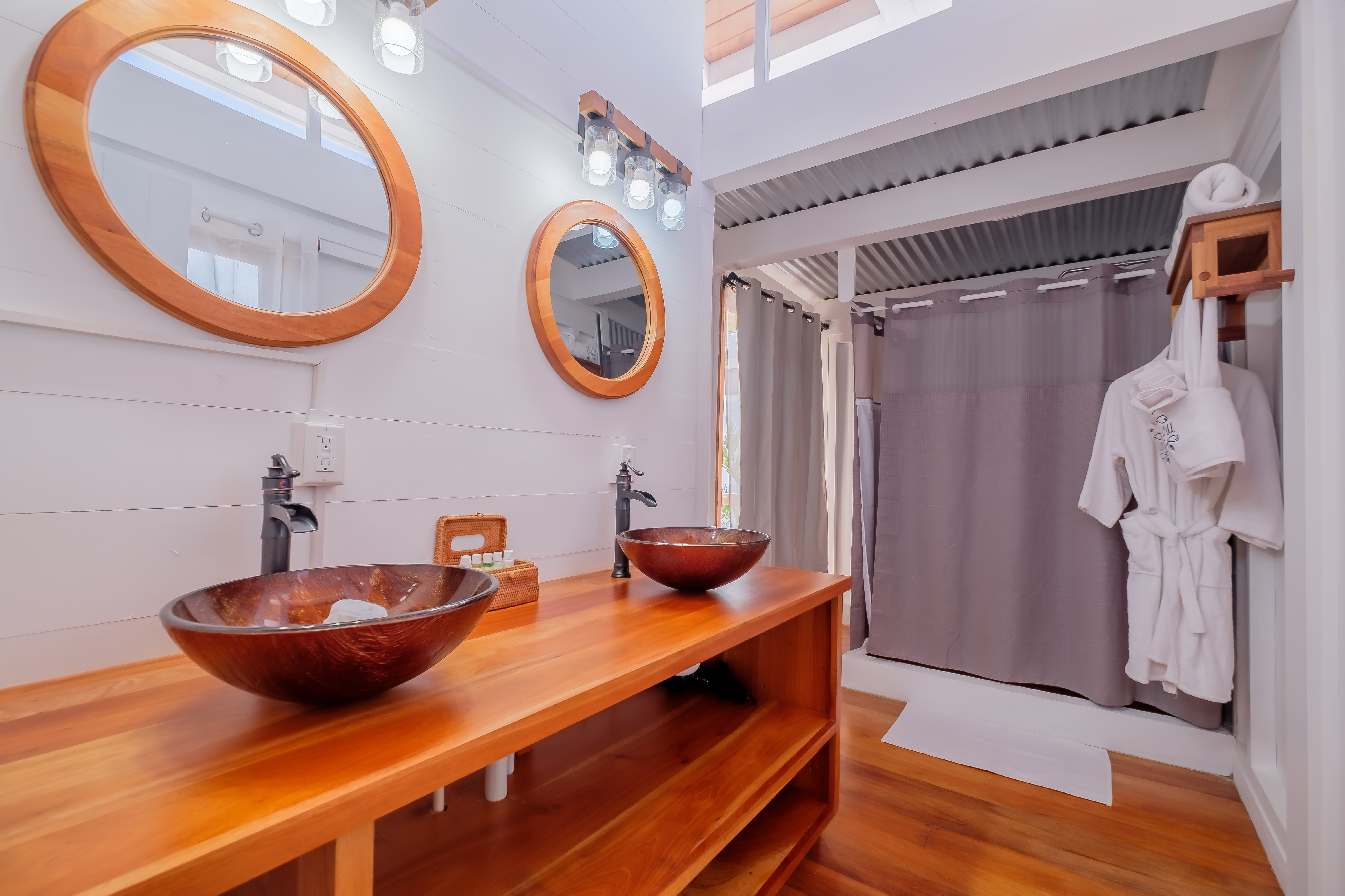 Modern bathroom sink with matte black faucet, hand soap, and marble countertop.
