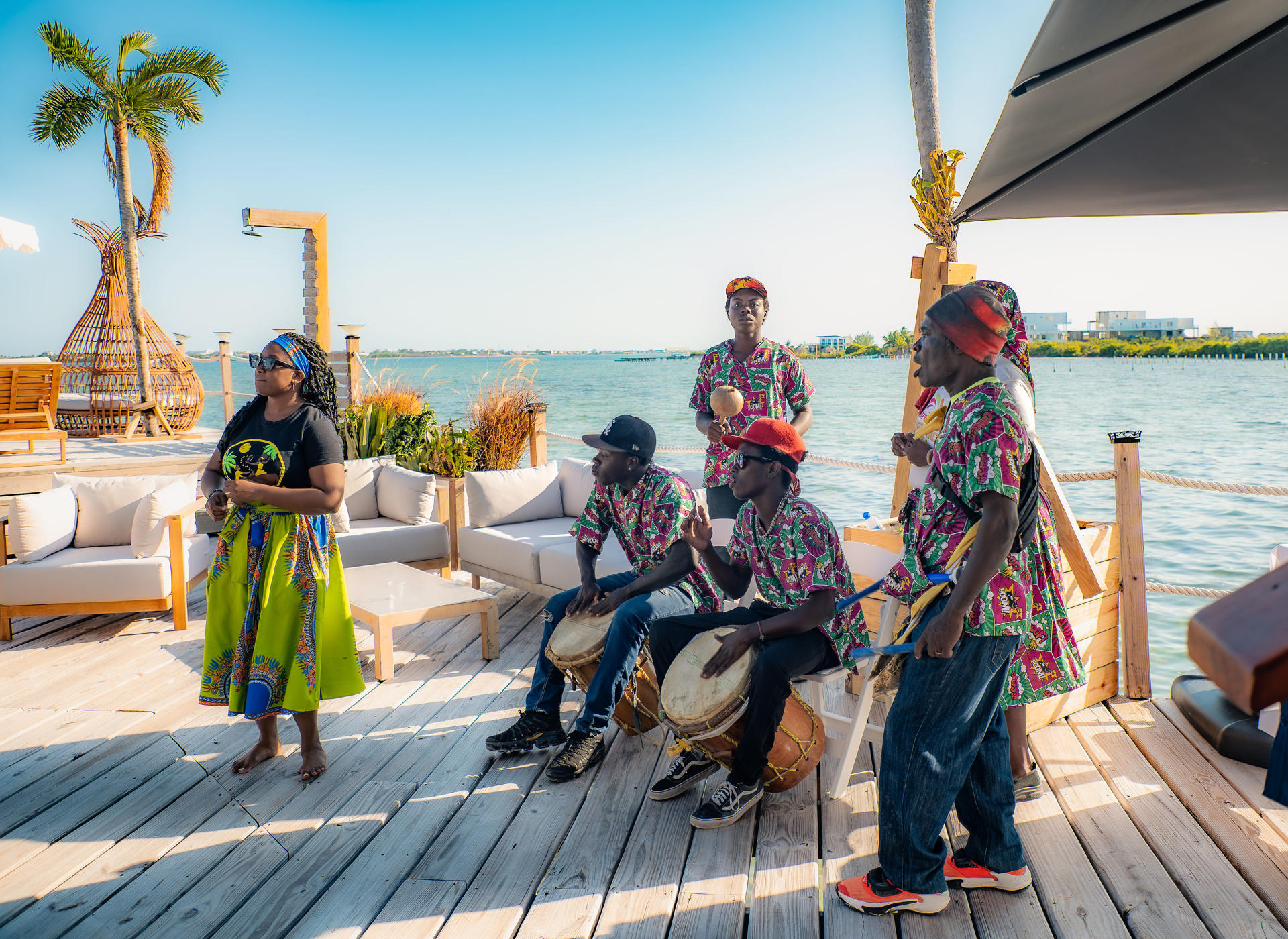 Garifuna drummers performing on the waterfront deck at Aruna Resort in Belize
