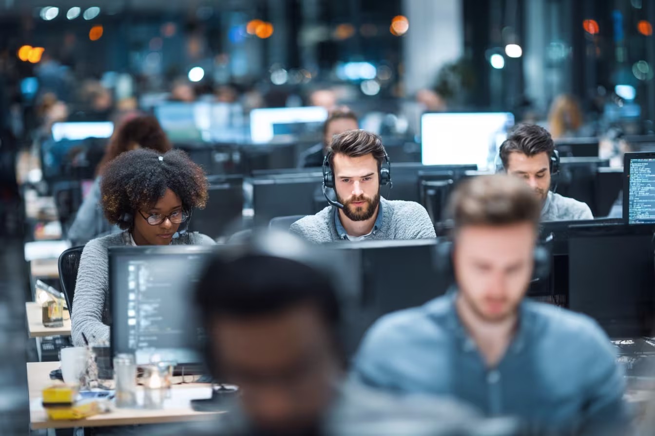 Diverse professionals in managed IT solutions workspace