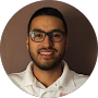 Smiling IT professional in glasses and white shirt, representing Hart Technologies managed IT support team in Tucson AZ