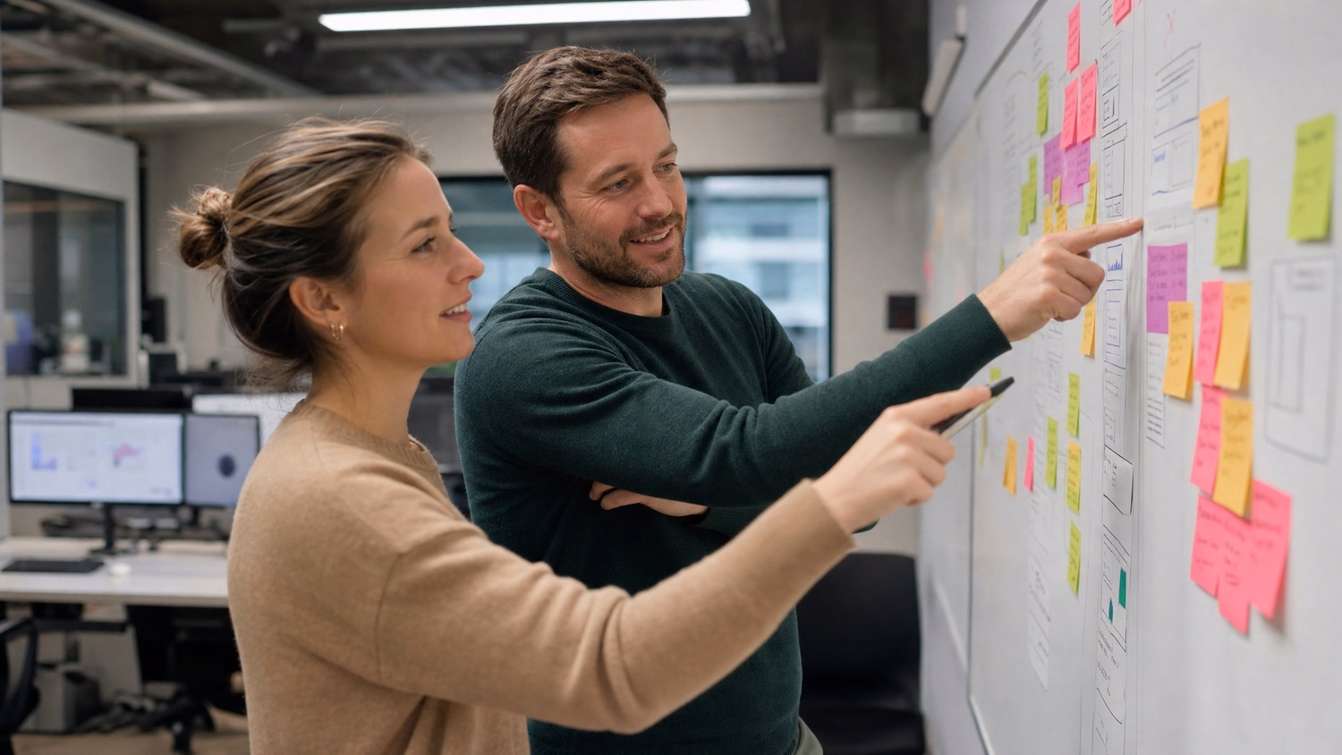 Team brainstorming with sticky notes and marker