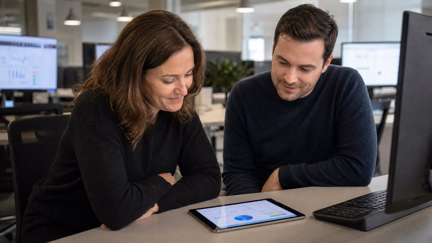Couple reviewing tablet data together, cloud backup