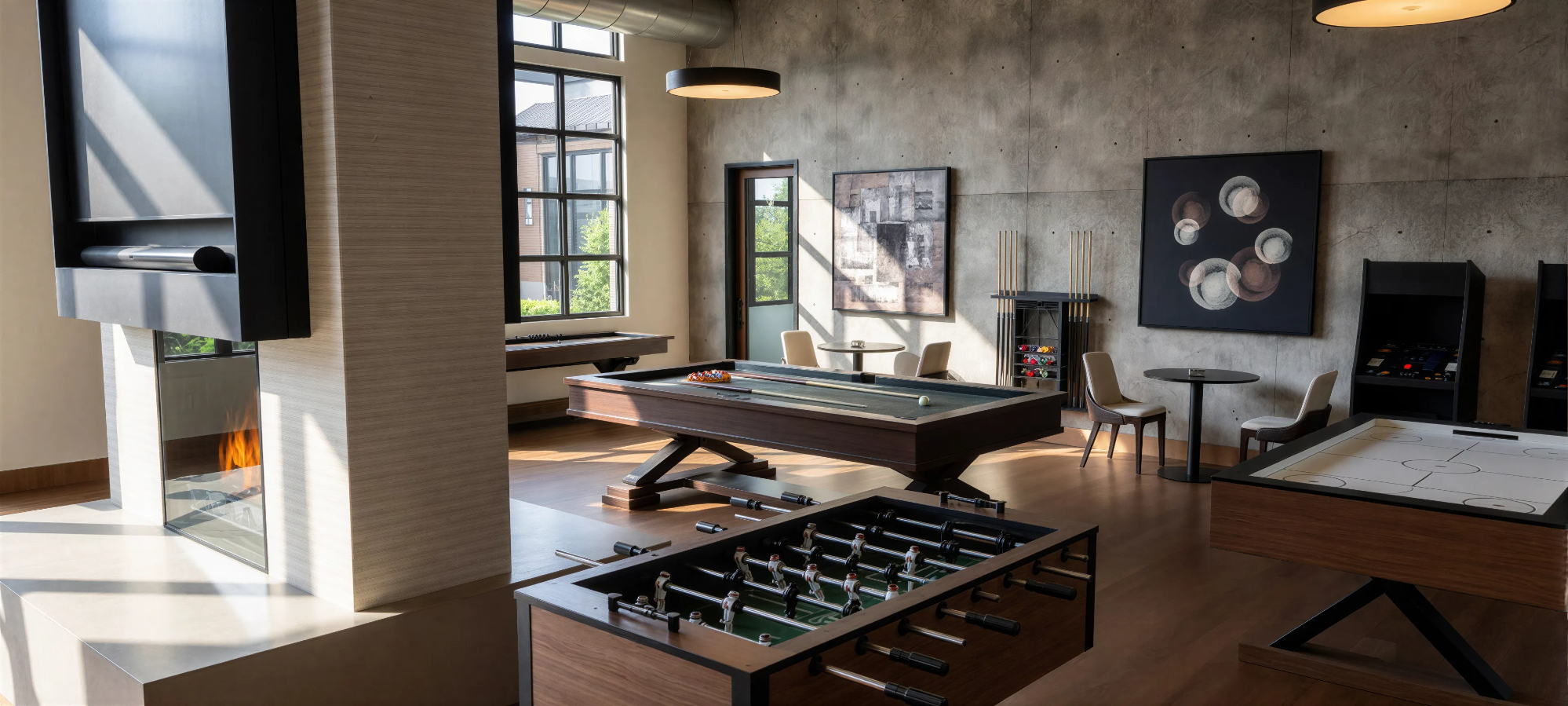 Rendering of game room in the daytime featuring billiards, foosball, and air hockey table