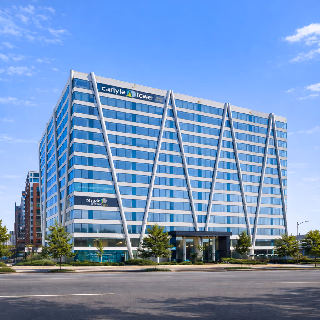 Carlyle Tower, a modern mid-rise office building with blue reflective glass and diagonal white structural beams.