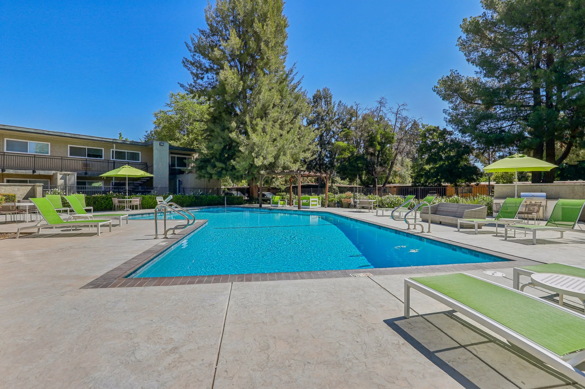 swimming pool with lounge chairs
