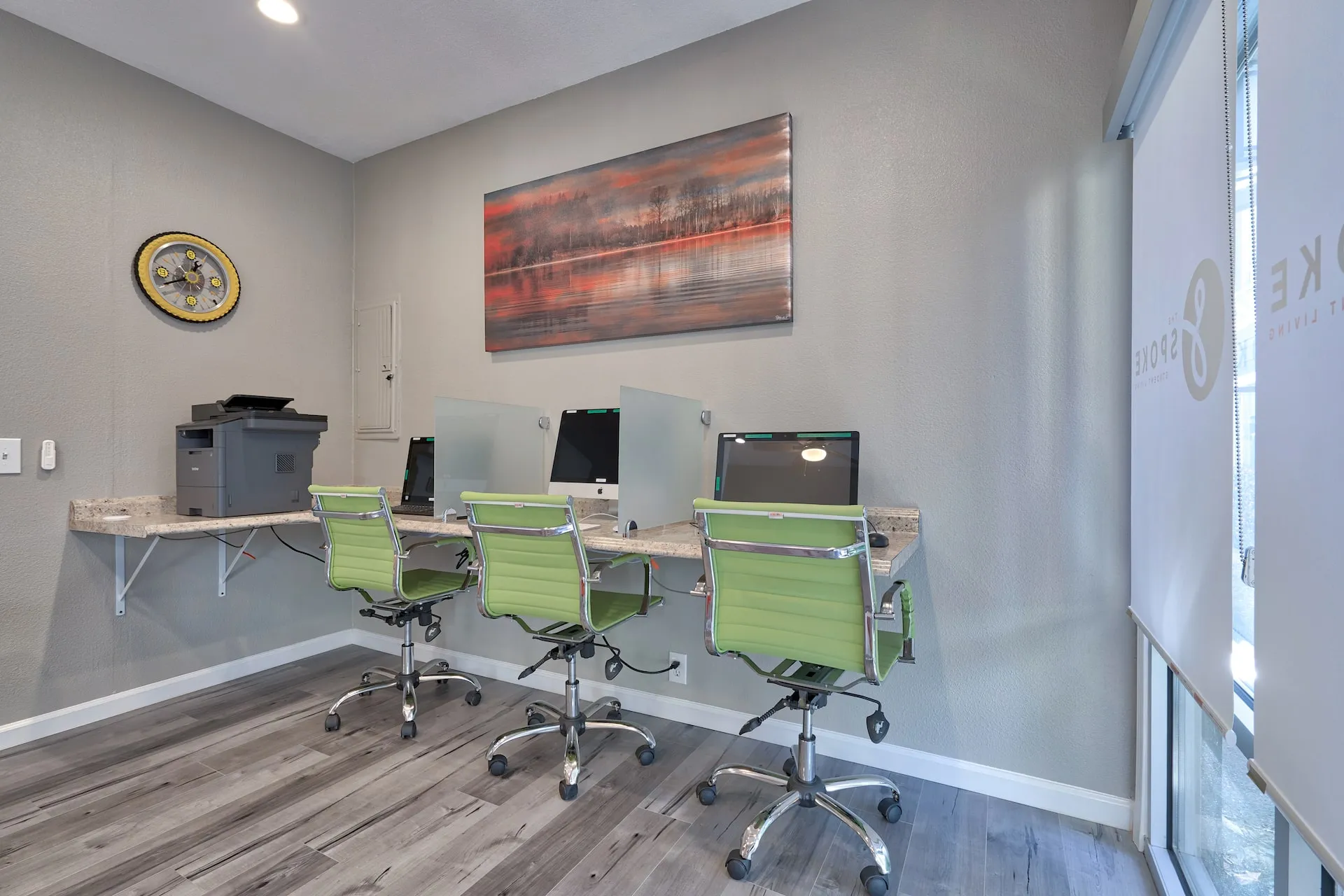 computer room with computers and desks with chairs