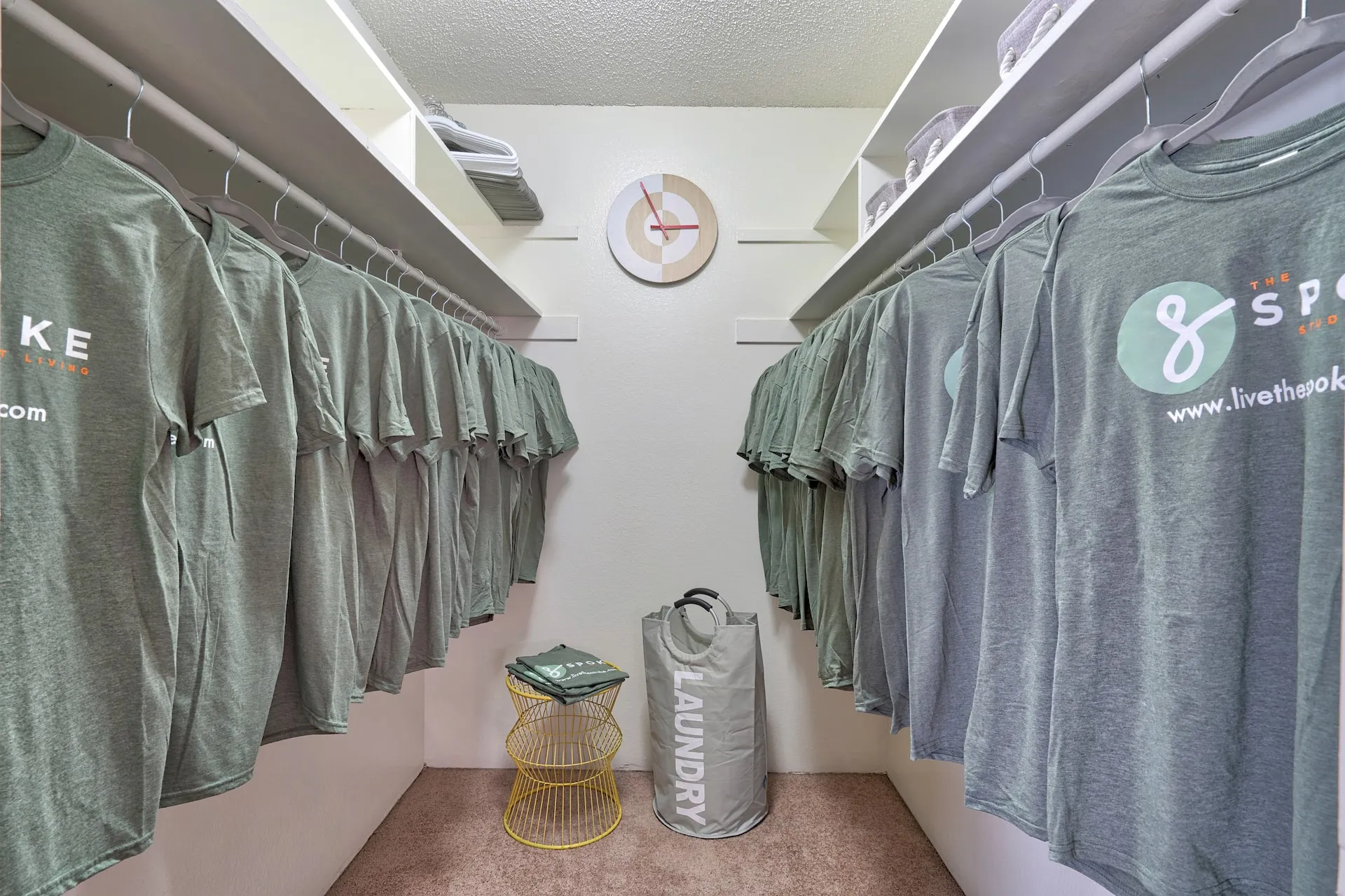 walkin closets with The Spoke t-shirts on hangers