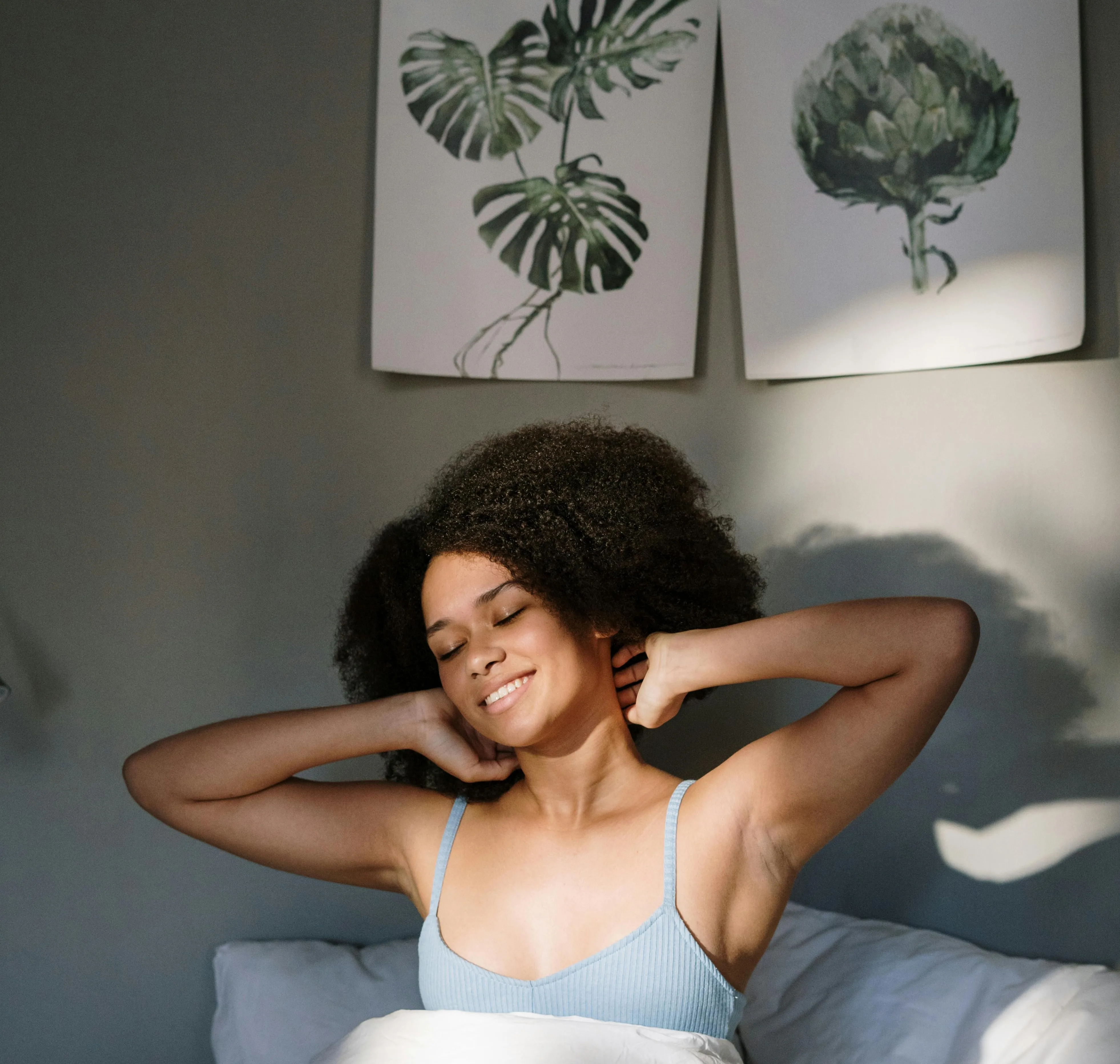 girl stretching in bed stock image