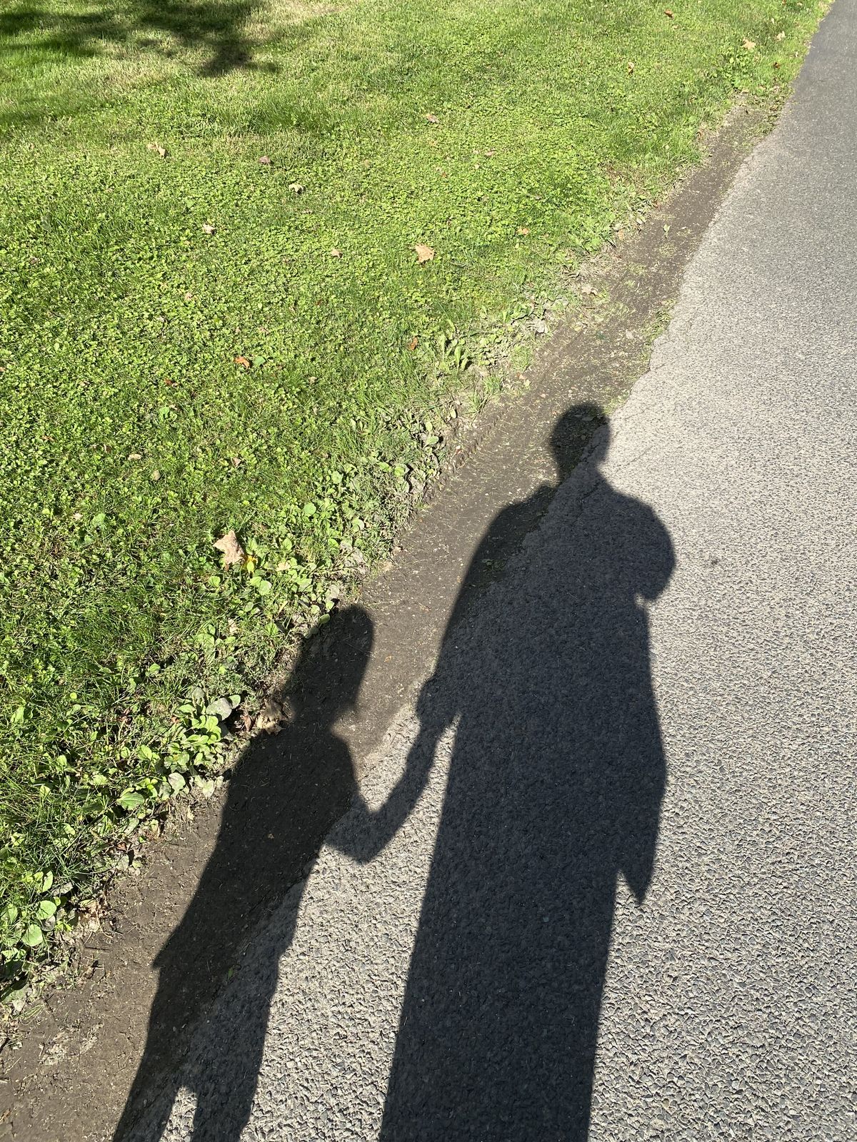 Au pair walking with host child during international cultural exchange program