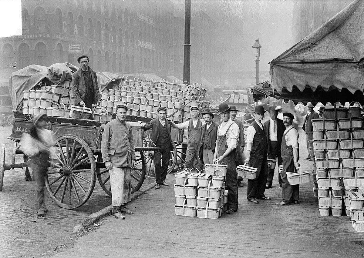 Men loading peaches at Water Street Market