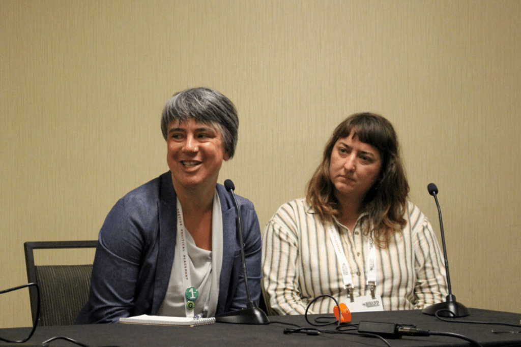 Erin Millar speaking next to Annelise Pierce.