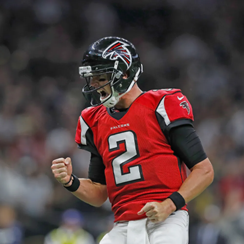 Atlanta Falcons football player, Matt Ryan, wearing number 2 jersey celebrating with clenched fists.