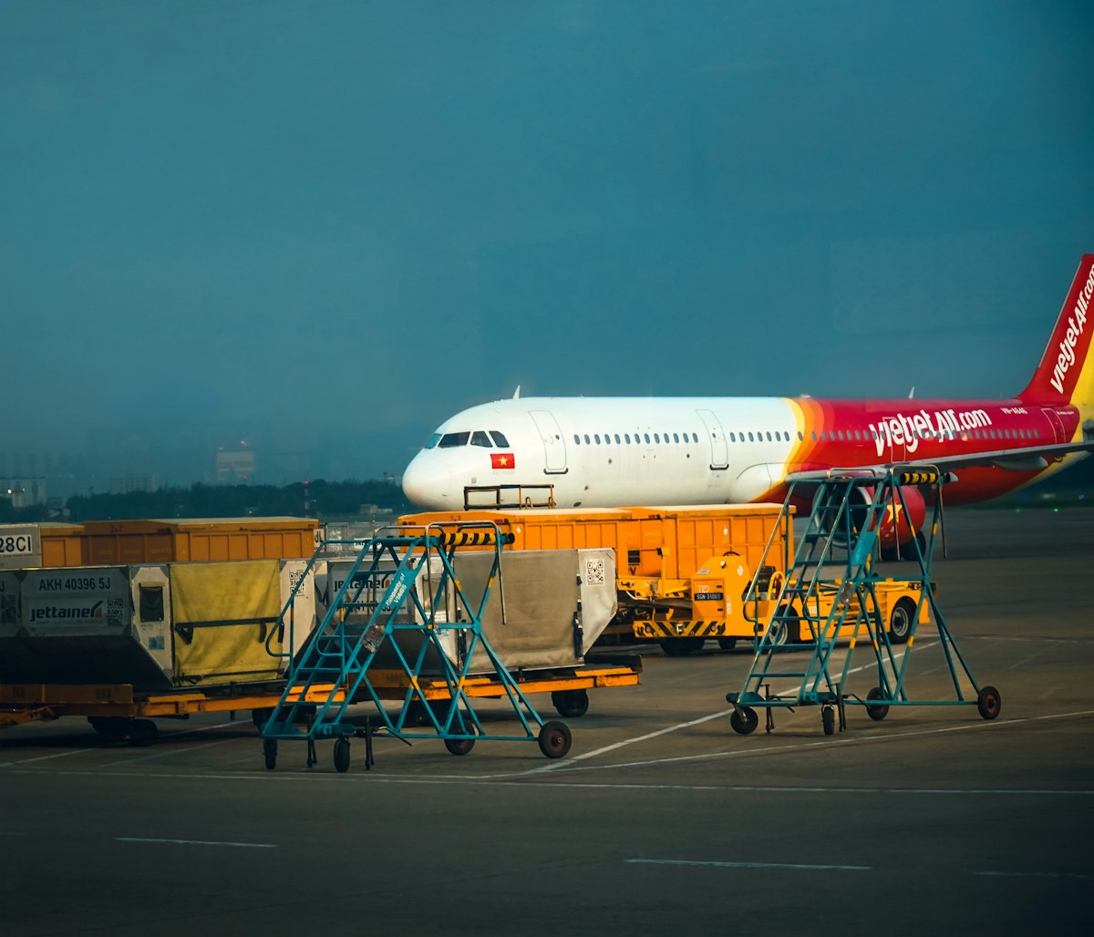 Aircraft being loaded with cargo on the tarmac.