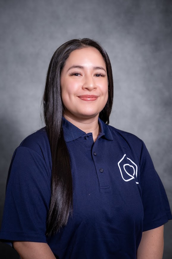 Mia Cabrera staff portrait in navy school polo shirt