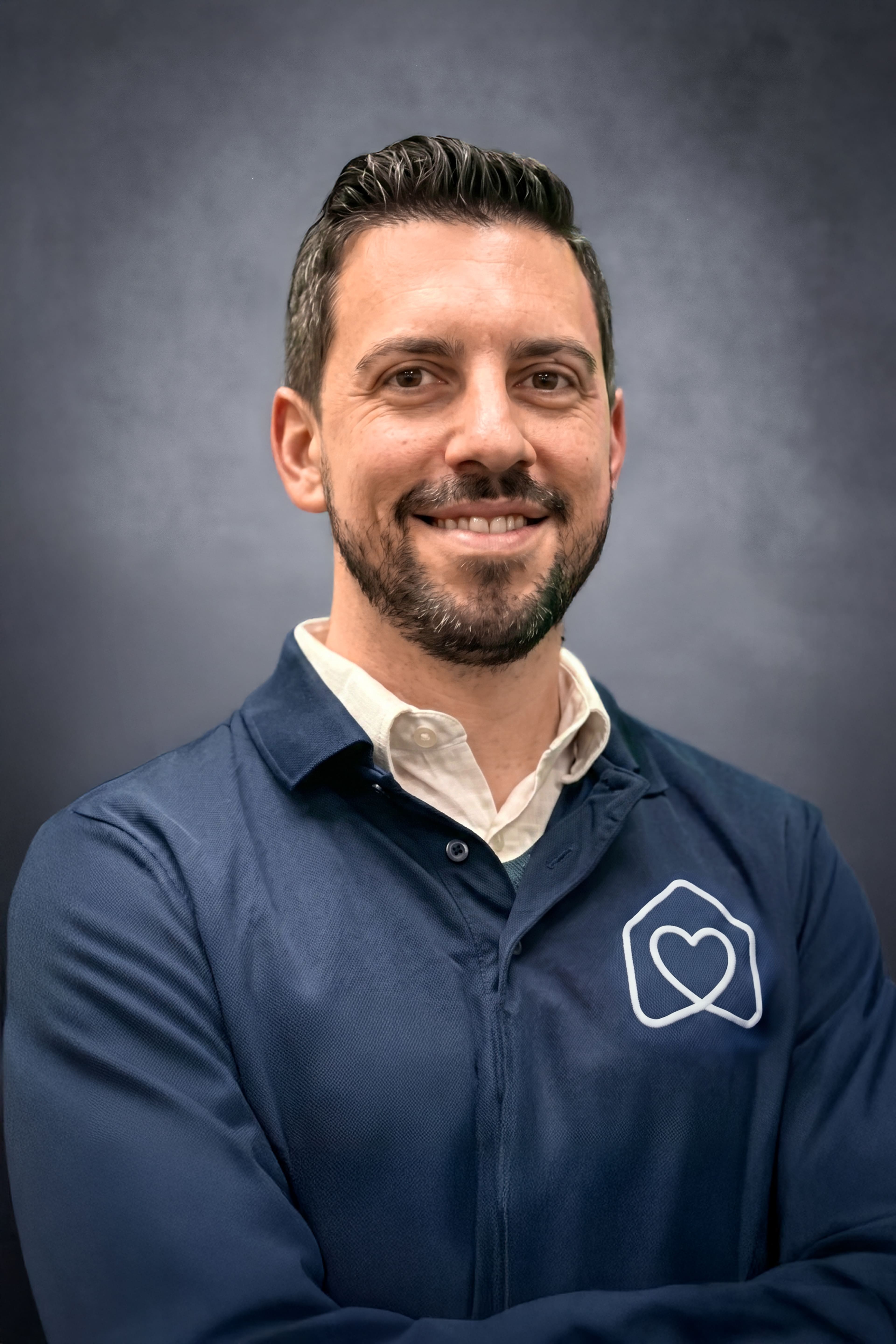 Nicholas DiSanto smiling in professional staff headshot portrait