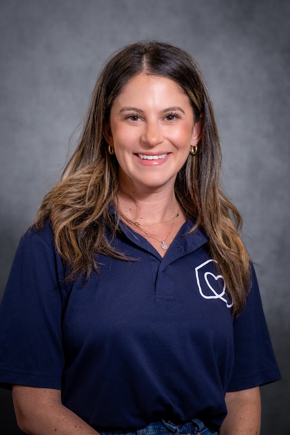Nicole Beinhorn staff portrait in navy school polo shirt