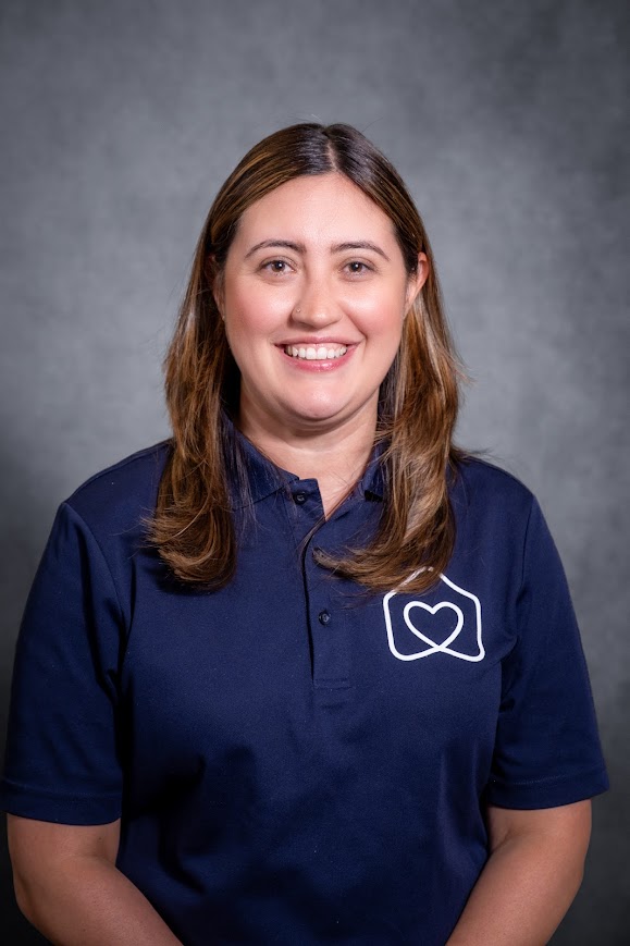 Staff member Danielle Lammering in school uniform polo shirt