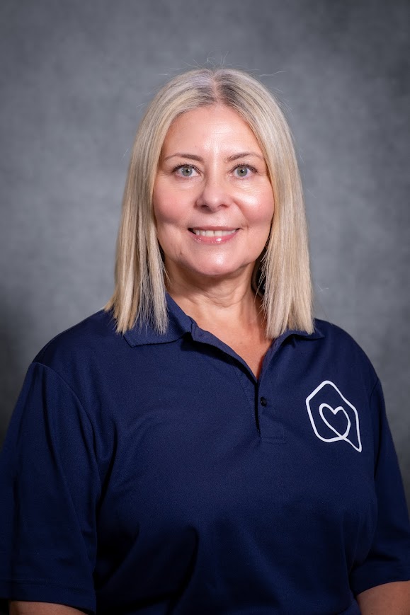 Ms Lisa Hidalgo smiling in school staff portrait