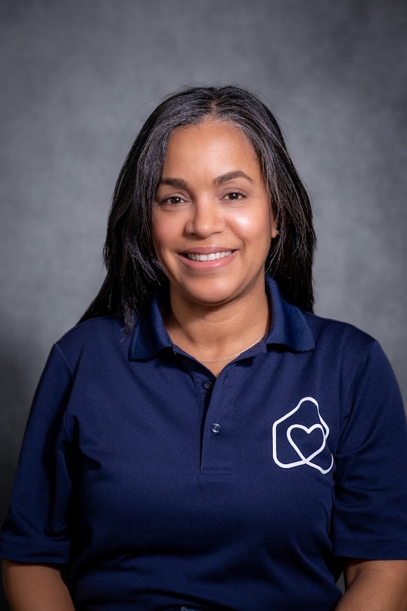Julissa Acevedo smiling in a navy Hearts Team polo shirt