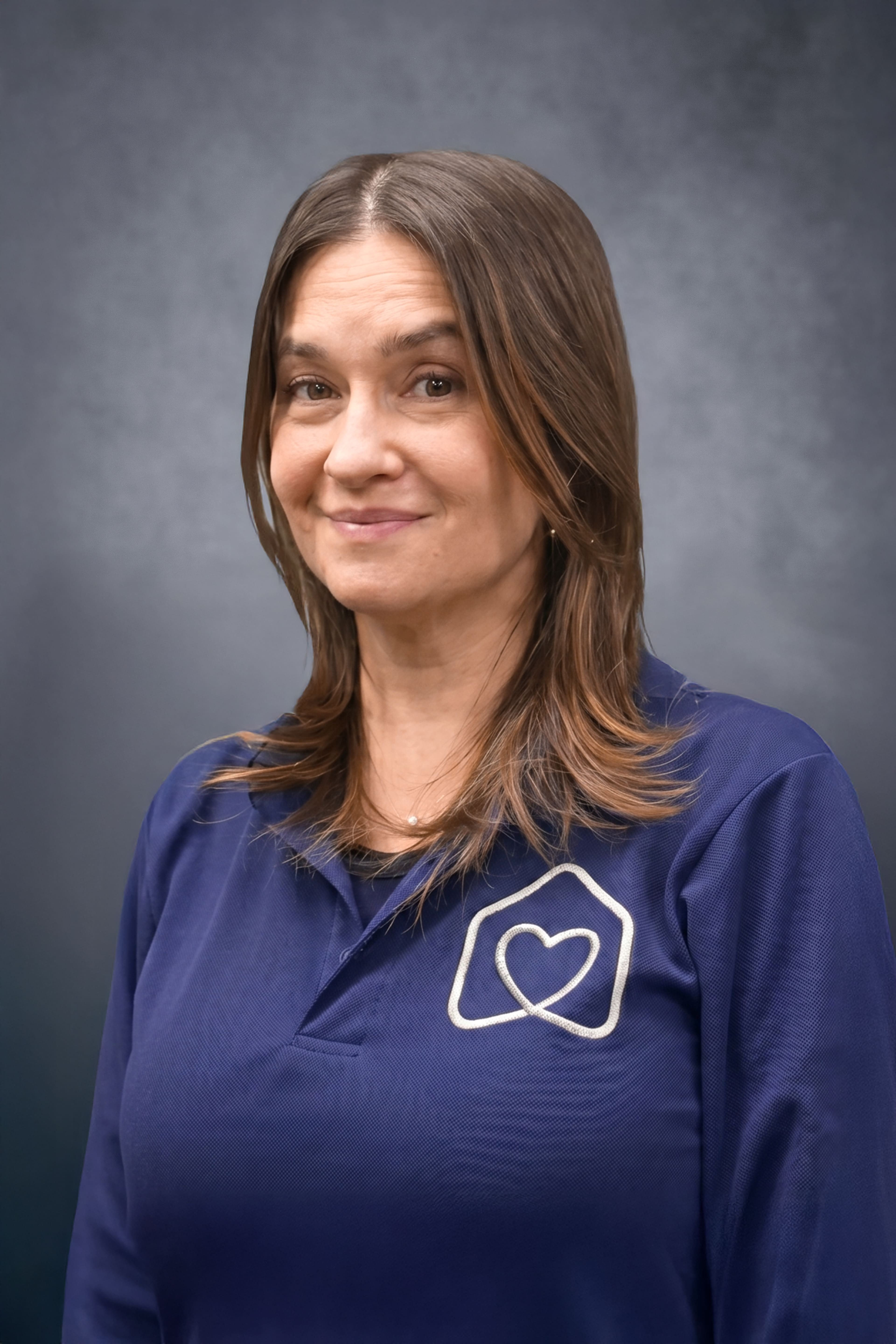 Rosalind Valenza staff member in navy school uniform shirt