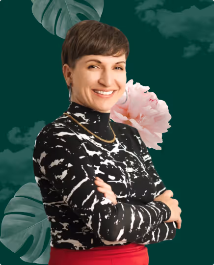Dani, founder of Beacon Design, smiling with arms crossed