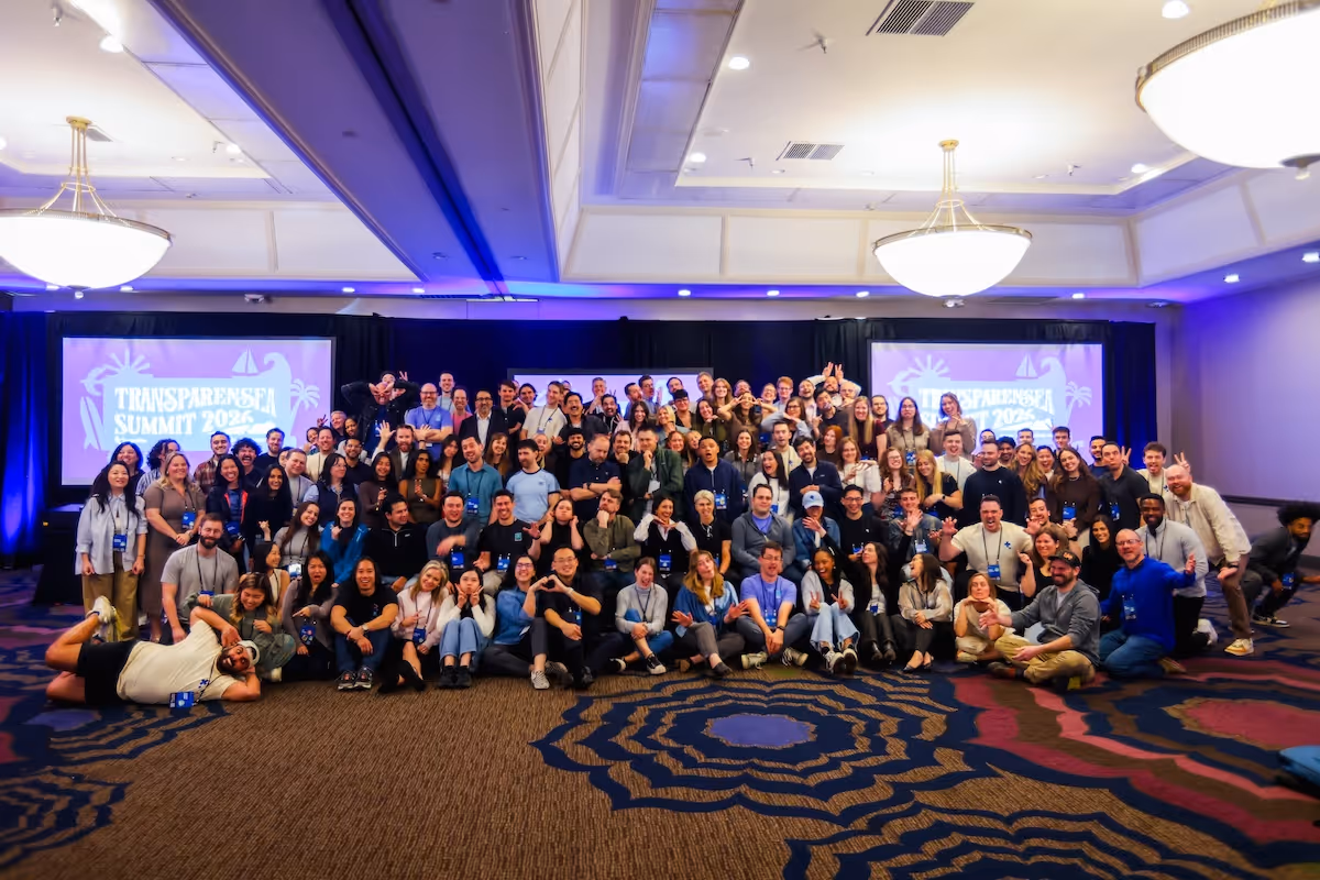 Large group of people posing together for a photo at the Transparensea Summit 2023 in a conference room.