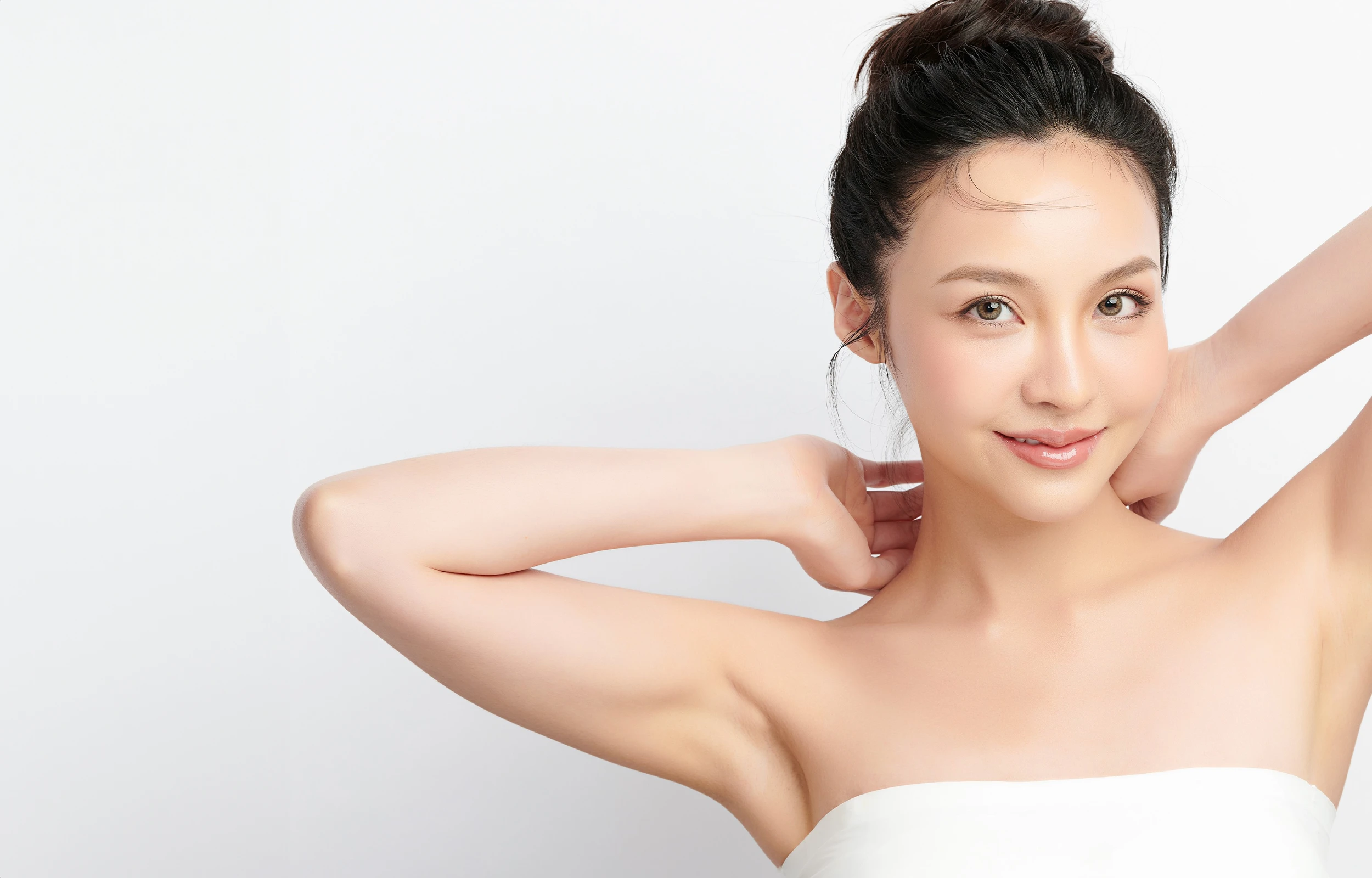 A woman showing her smooth armpits