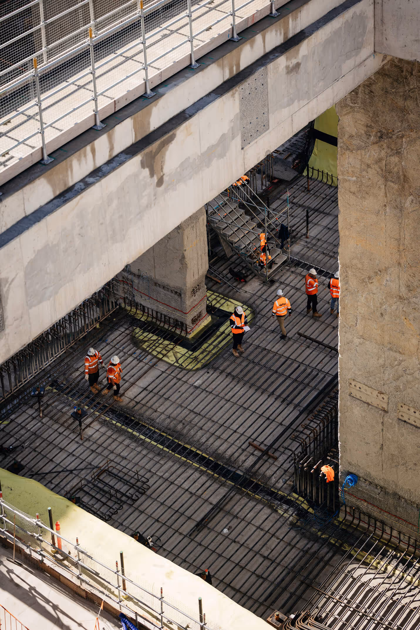 Construction crane mast against blue sky