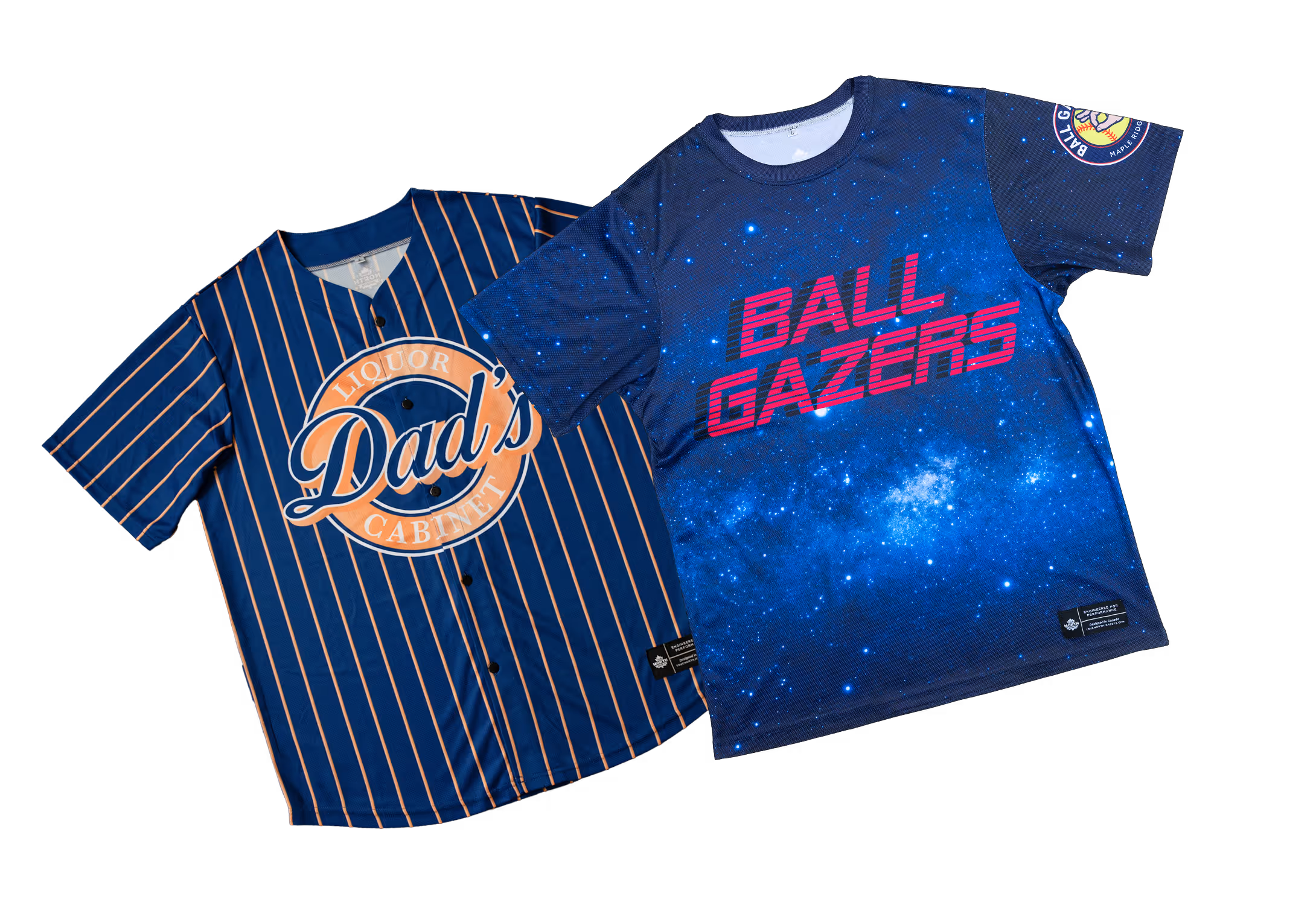 Two blue baseball-style shirts; one with orange pinstripes and 'Dad's Liquor Cabinet' logo, the other with a galaxy pattern and 'BALL GAZERS' text.