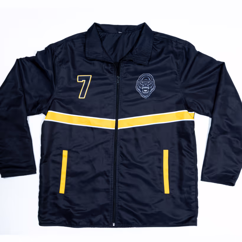 Black zip-up jacket with yellow stripe across the chest, yellow pocket accents, number 7 on left side, and roaring gorilla emblem on right side.