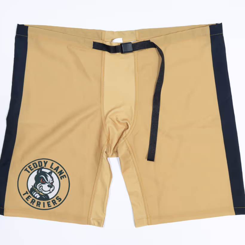 Beige and black athletic shorts featuring a black adjustable belt and Teddy Lane Terriers logo on the left leg.