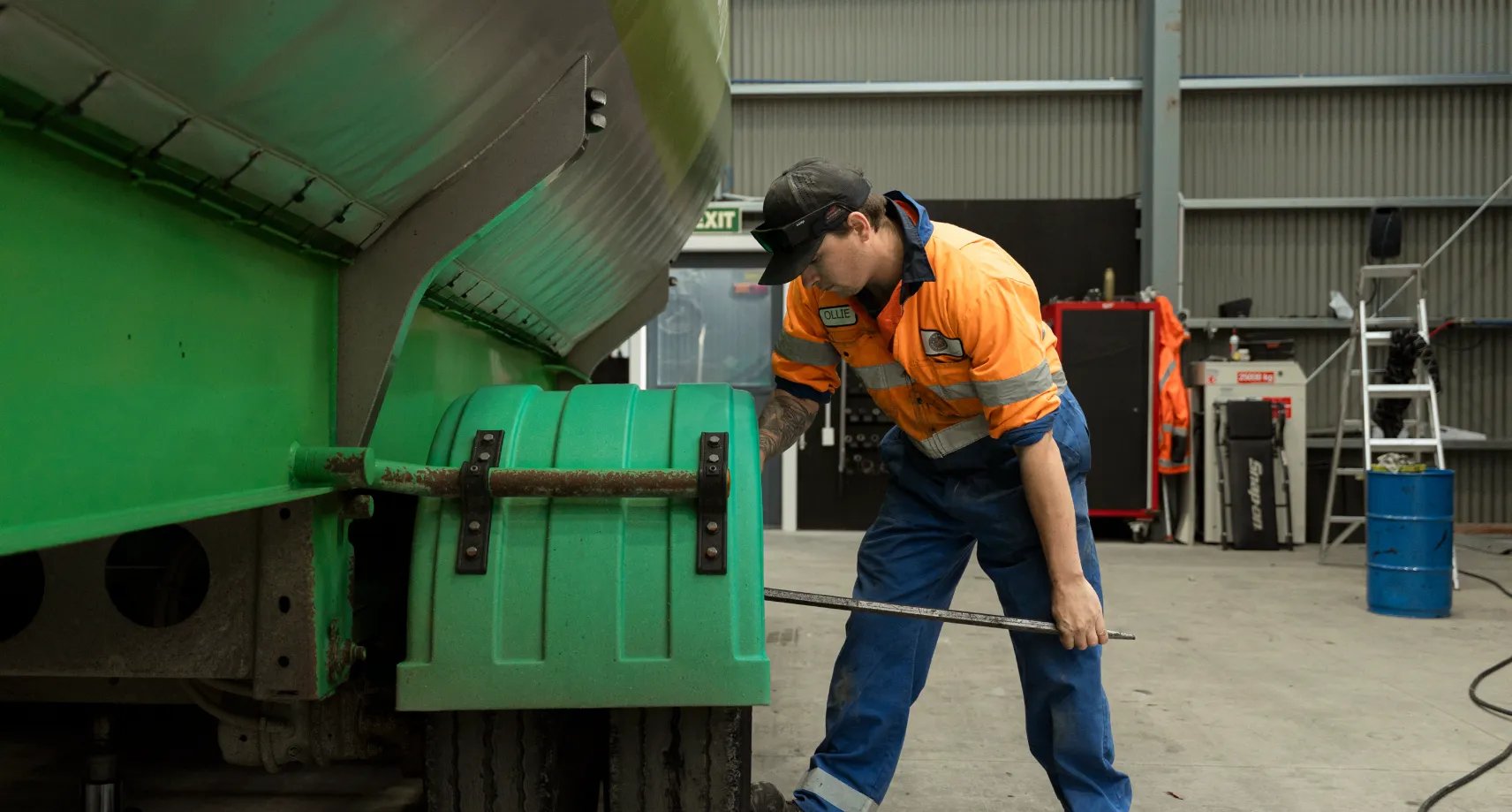 Mechanic working on larger tanker trailer at Keast Auto Repair in Invercargill