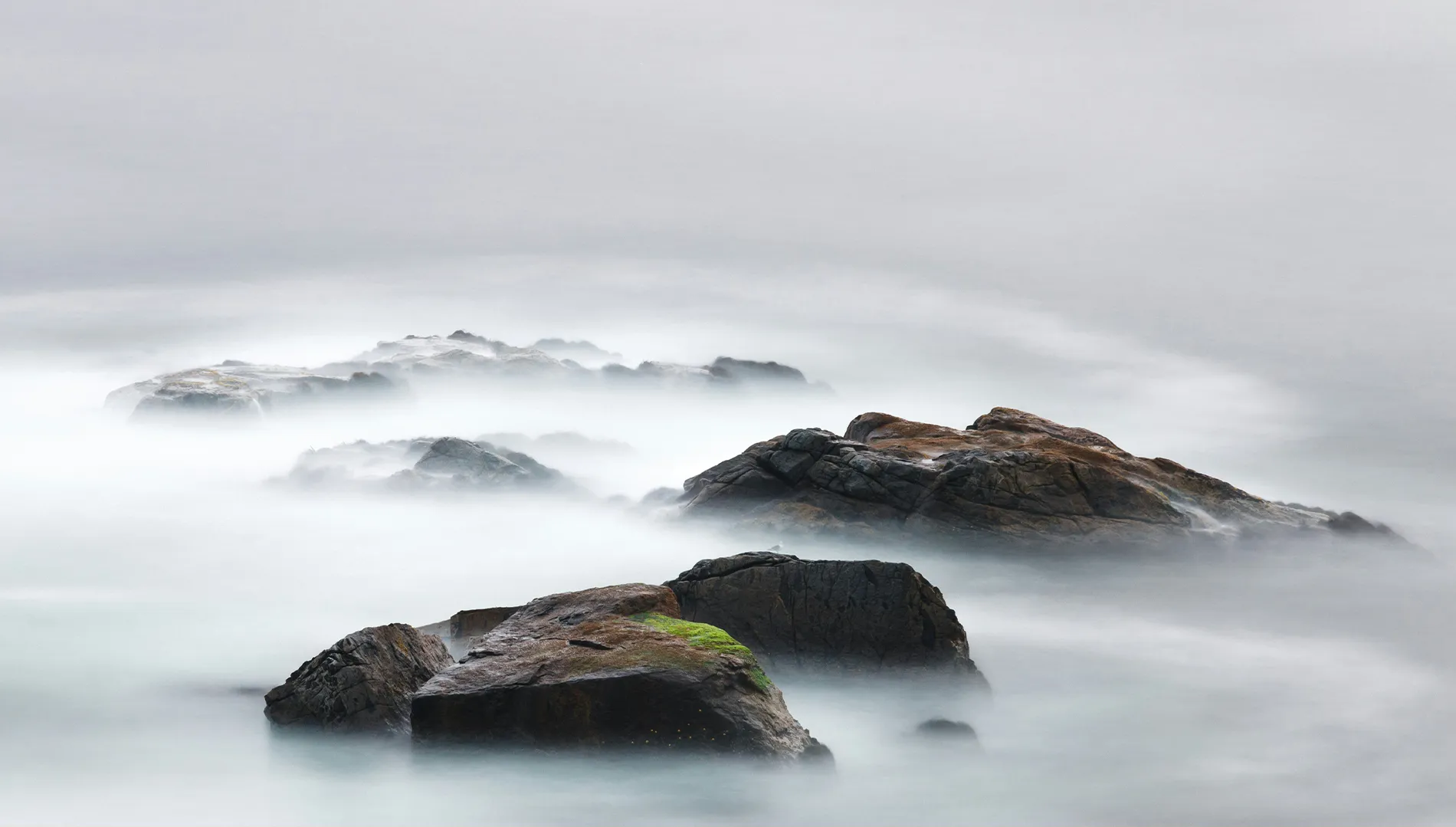 Rocky mound covered with a white mist.