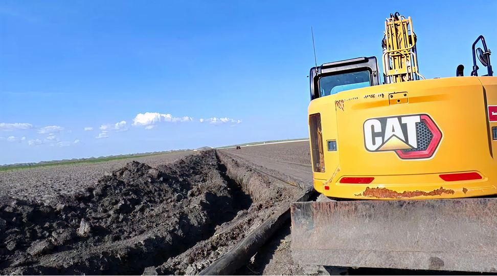A tractor clearing the land
